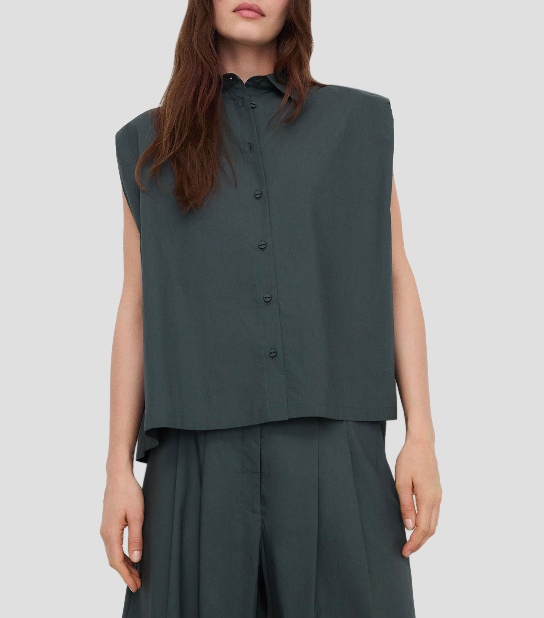 Blusa lisa sin mangas Mujer